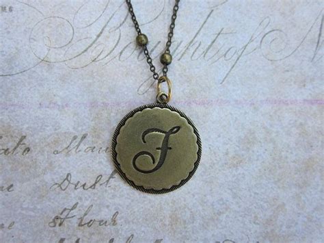 Alphabet F pendant in brass 